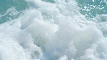 Obraz premium Ocean waves foam closeup, sunny day, sea texture, background for website