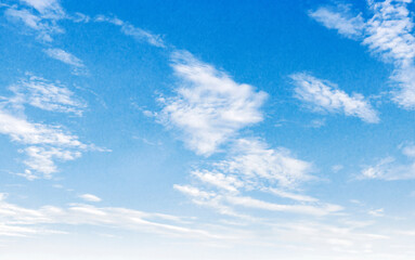 Fototapeta premium The sky is blue and clear with a few clouds scattered throughout