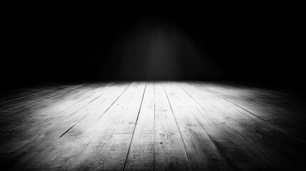 Dark room with spotlight on wooden floor.