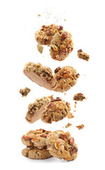 Yummy nut cookies falling on white background