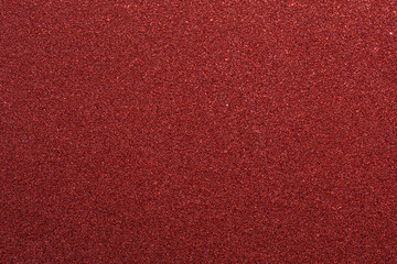 A red background with a lot of red glitter