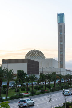 A busy urban road alongside the great mosque of Algiers in Algeria.