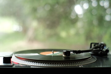 Record Player in a room with green background
