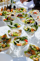 Refreshing gourmet salad selection on a sunny outdoor table for a festive gathering