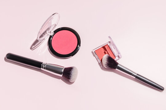 Elegant makeup essentials include blushes and brushes on pastel