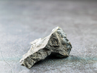 Close-up of basalt stone on gray background