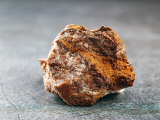 Close-up of zinc ore on gray background