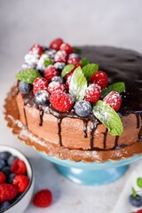 Homemade vanilla layered sponge cake with chocolate buttercream frosting