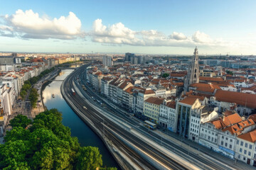 Obraz premium A city with a river running through it and a train track