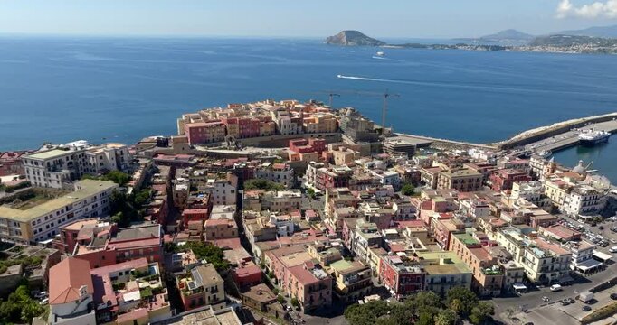 Aerial panoramic view of the city of Pozzuoli, near Naples, Italy. In background are the Tyrrhenian Sea, the promontory of Capo Miseno and Ischia island.