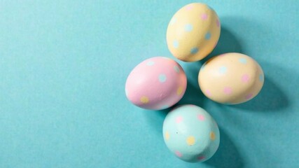 colored eggs on a blue background with empty space for text
