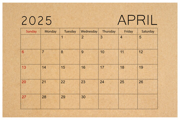 Brown paper calendar for April 2025 isolated on white background.