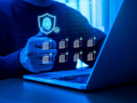 Biometrics fingerprint, thumb scan access control by businessman with safety shield icon, and locked files on computer virtual screen. Cyber security. privacy data protection technology for business.