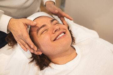 Relaxing spa experience with man receiving facial massage