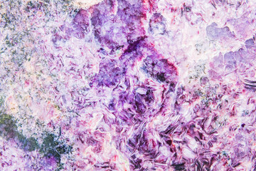 Bright charoite with a coarsely banded structure. Polished sample