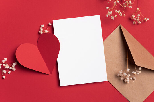 Valentines day card mockup, envelope and heart with flowers on red background, blank card with copy space for design