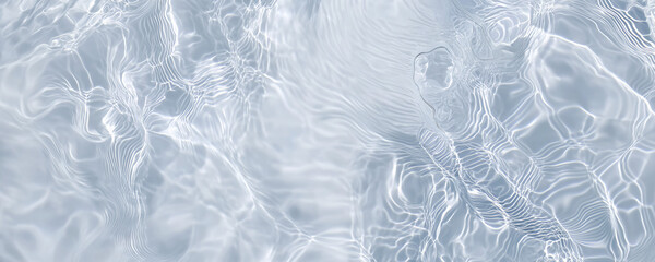 Obraz premium Top-view of water ripples in a pool, showcasing a blend of blue and white tones. Captured with precision, this image is perfect for artistic and commercial uses.