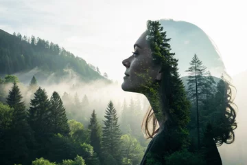 creative double exposure portrait of a woman with flowing hair and misty forest © Anim