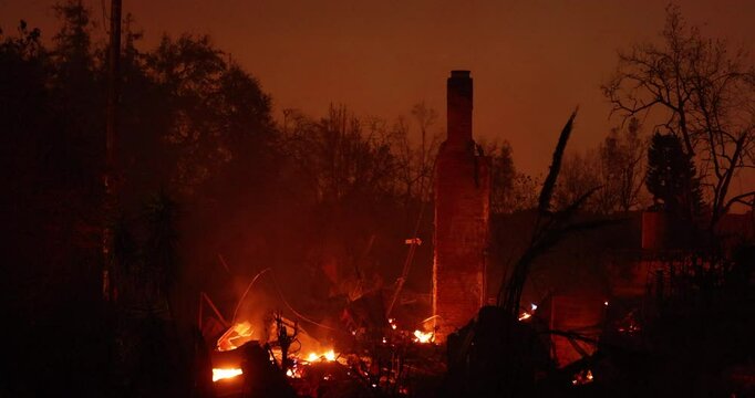 Altadena, California, USA - January 8, 2025: Powered by extreme Santa Ana winds, the Eaton Fire tears through a domestic neighborhood.