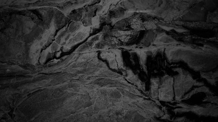 the image showcases a close-up view of a luxurious black marble surface, characterized by intricate veining and a captivating blend of light and dark tones, use as a background or texture in design.