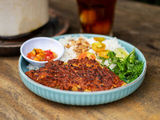 Ikan bakar parape. A traditional Indonesian food menu of grilled fish cooked with a sprinkling of hot chili seasoning, eaten with a portion of white rice.