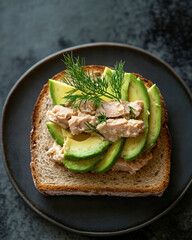 Delightful toasted sourdough topped with creamy tuna mayo, fresh dill, and ripe avocado for a wholesome snack
