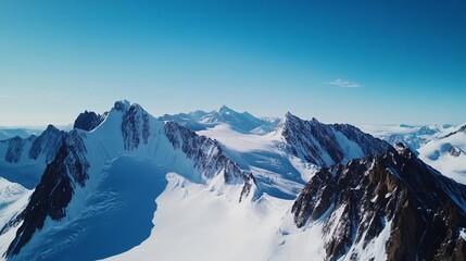 A mountainous terrain covered in snow, Alpine style, photo of