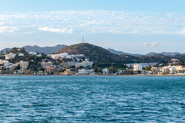 Fototapeta premium Coast Line near Malaga, Costa del Sol, Spain shoot from the boat during sunset. Beautiful Alboran Sea
