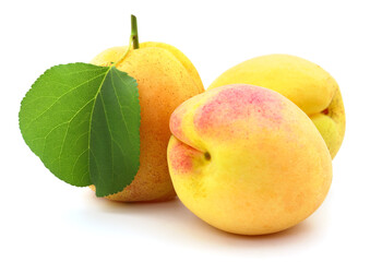 Apricots with leaves.