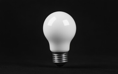 A pristine white light bulb against a dark background, showcasing its simple and modern design for creative projects.