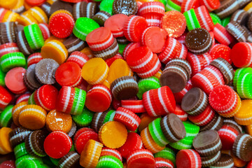 pile of colorful jelly and marmalade candies of different shapes at the market.