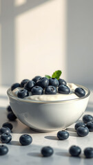 - Healthy breakfast option of yogurt and blueberries served in a bowl, creamy consistency, health food