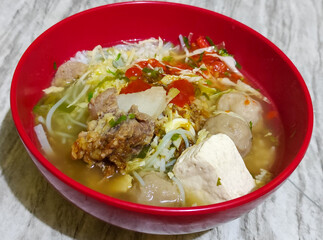 Bakso. Bakso is a very popular food in Indonesia, can be served with tofu and beef bones. Bakso is made from minced beef or chicken mixed with tapioca flour, garlic, and other ingredients.