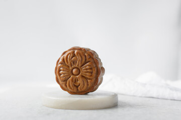 homemade mooncakes on a white background, top view of baked mooncakes on white table, process of making mooncakes for Lunar New Year and mid autumn festival