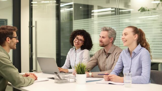 Interview with confident candidate at business firm office, with headhunter agent and applicant and at the end there is a handshake with acceptance to the job