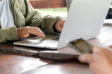 Person using laptop, focusing on touchpa