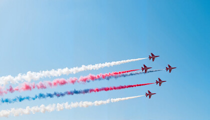Military jets flying in formation with red, white, and blue trails, patriotism