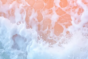 Fototapeta premium Rocky coastline with waves crashing and a vibrant orange horizon, dynamic and powerful, banner focus.