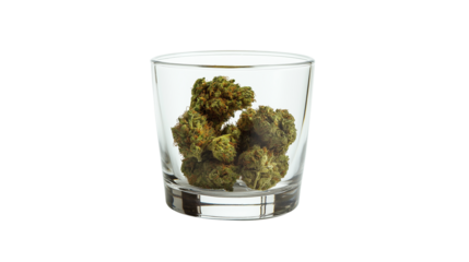 Glass with cannabis on the top isolated on a white background