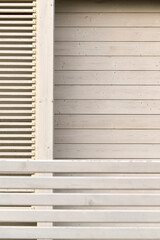 Close-up of modern wooden slatted wall design with horizontal and vertical lines