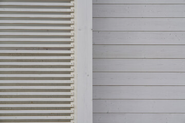 Fototapeta premium Close-up of a wooden slatted and paneled wall with a minimalisti