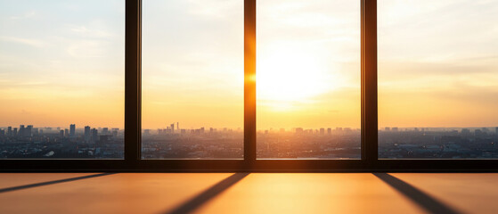 Fototapeta premium Stunning sunset view through large windows in a modern urban setting.