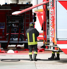fire truck and a firefighter during an emergency in the city