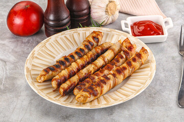 Grilled meat sausages wrapped bacon