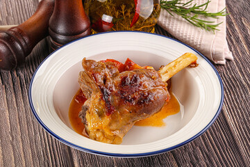 Baked lamb shank with vegetables