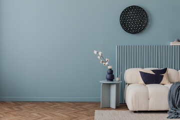 Cozy corner with a textured armchair, cotton branch vase, and subtle light. A tranquil retreat in a...