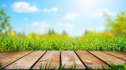 wooden deck with a vibrant green grass field and sunny blurred background ideal for nature-themed promotions and outdoor product displays