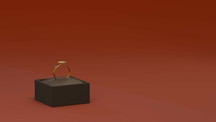 Shiny gold ring in a black box on a rich red background