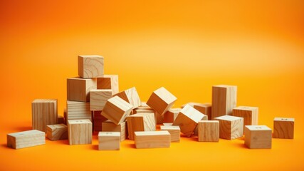 Scattered Wooden Blocks on Vibrant Orange Background, Ideal for Conceptual Designs and Educational Materials
