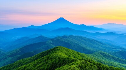 Fototapeta premium Majestic mountain peak at sunrise, layers of hills and forests, scenic landscape.